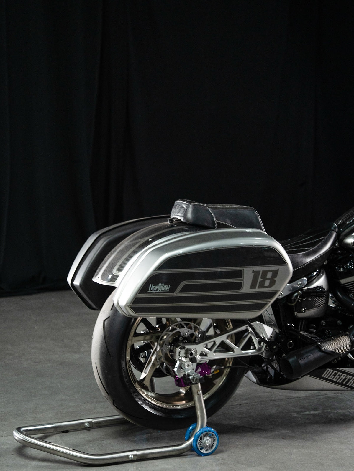 Silver graphics and exposed weave continue across the saddlebag.