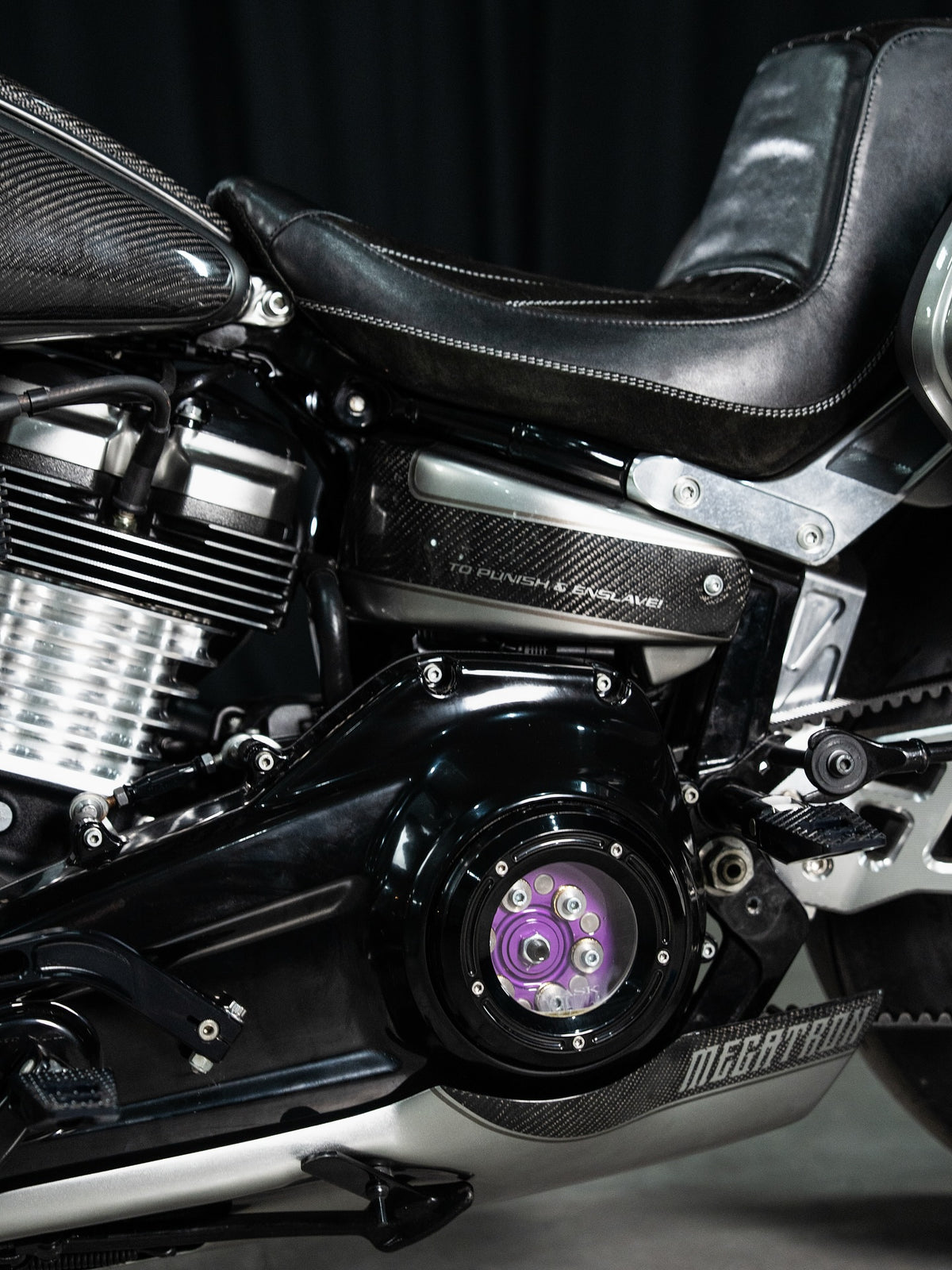 Black engine cases, bright cooling fins and a purple window-cover detail.